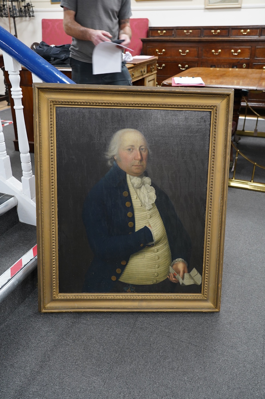 Mid 19th century English School, oil on canvas, Half length portrait of a gentleman holding a letter, unsigned, 75 x 60cm. Condition - fair to good, relined